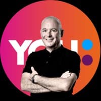 Professional headshot of John Williams, founder of Agencia You