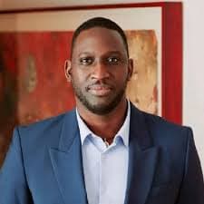 Professional headshot of Naolo Charles, founder of Beinitiative